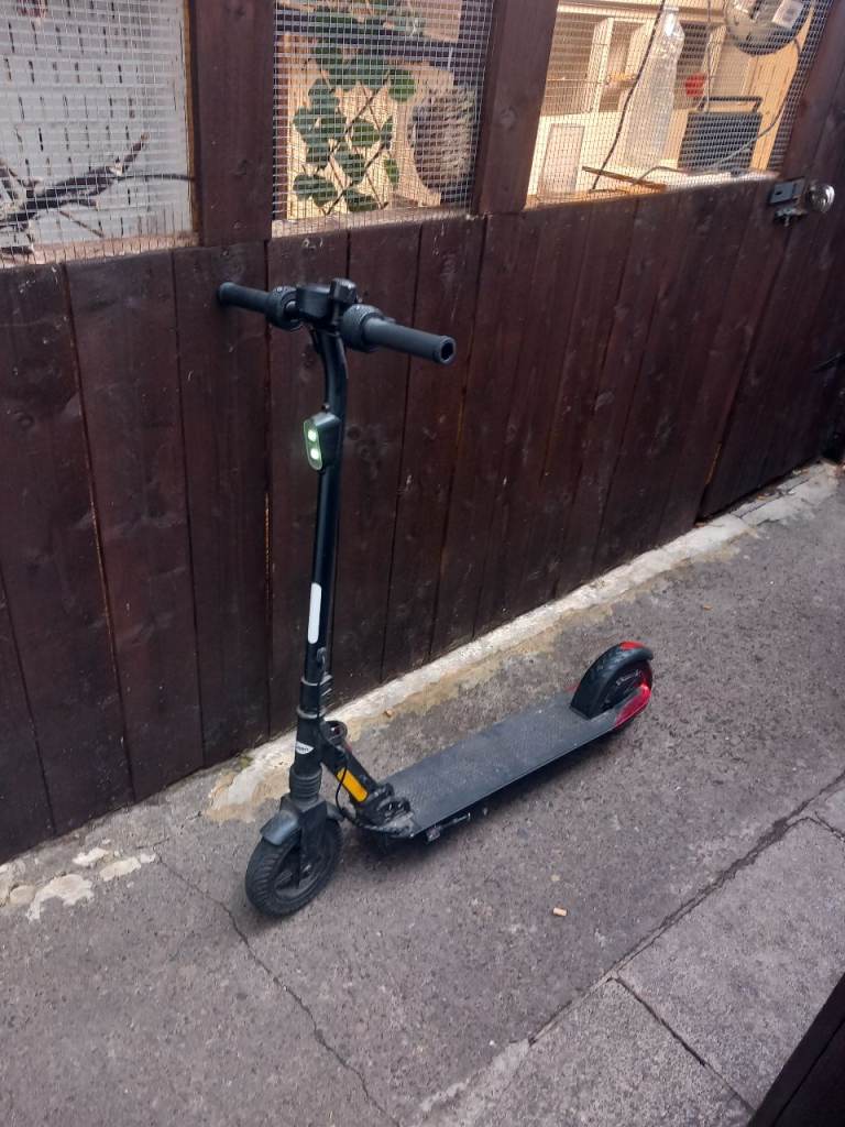 Electric Scooter - Black with Red Accents, Good Condition