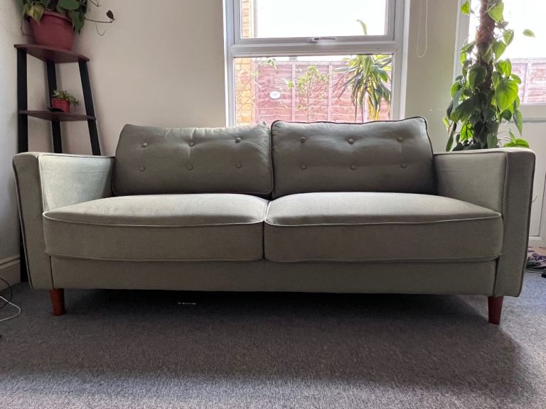 Green large comfortable sofa