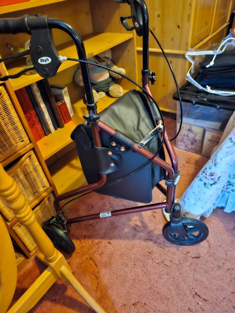 Red and black mobility aid walker