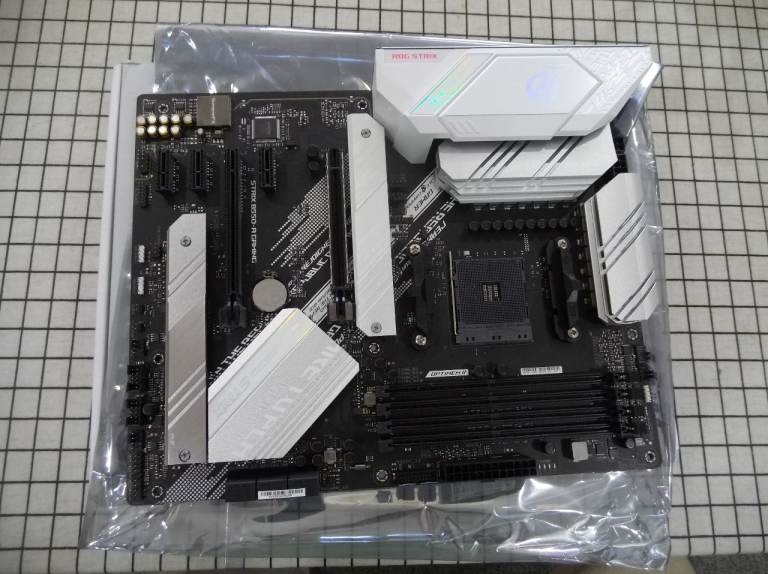 RoG Strix B550-A Gaming ASUS Motherboard. White.  ATX. No bent pins or broken clips, runs perfectly.