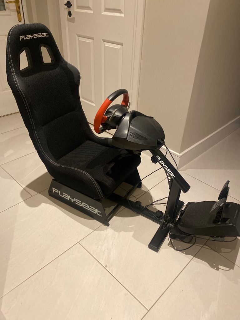Play seat with Ferrari steering wheel and pedals