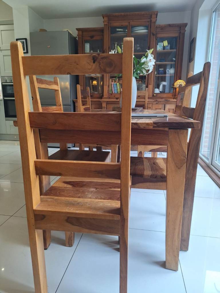High quality natural tropical hardwood dining room table and chairs.