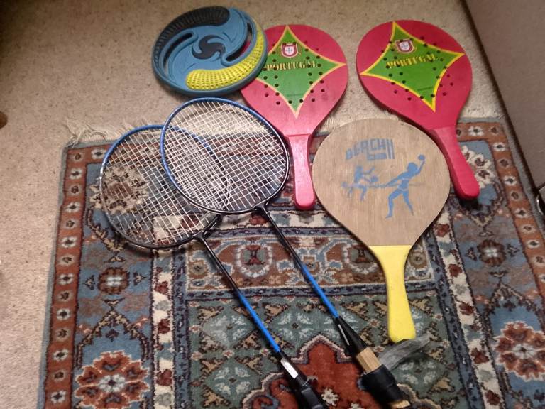 A vintage very collectable beach sports bundle, 3 beach bats, pair of badminton rackets 