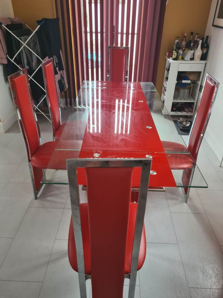 Red and Clear Glass Dining Table and Chairs
