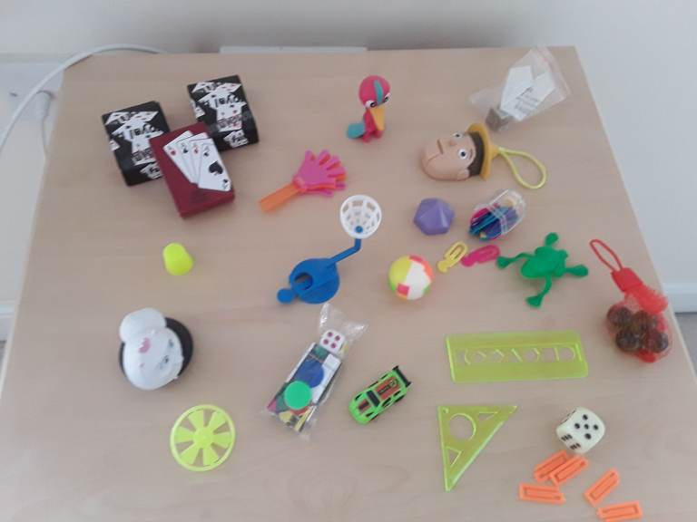 Collection of small figurines, games and toys