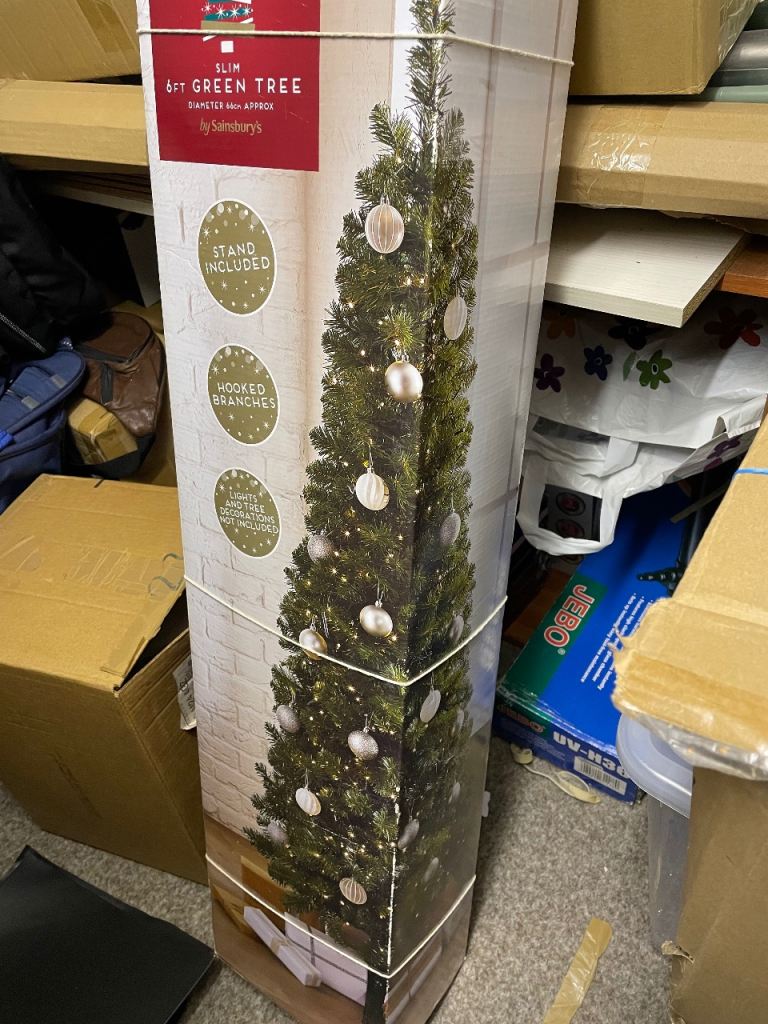 6ft green Christmas tree with stand, no lights 