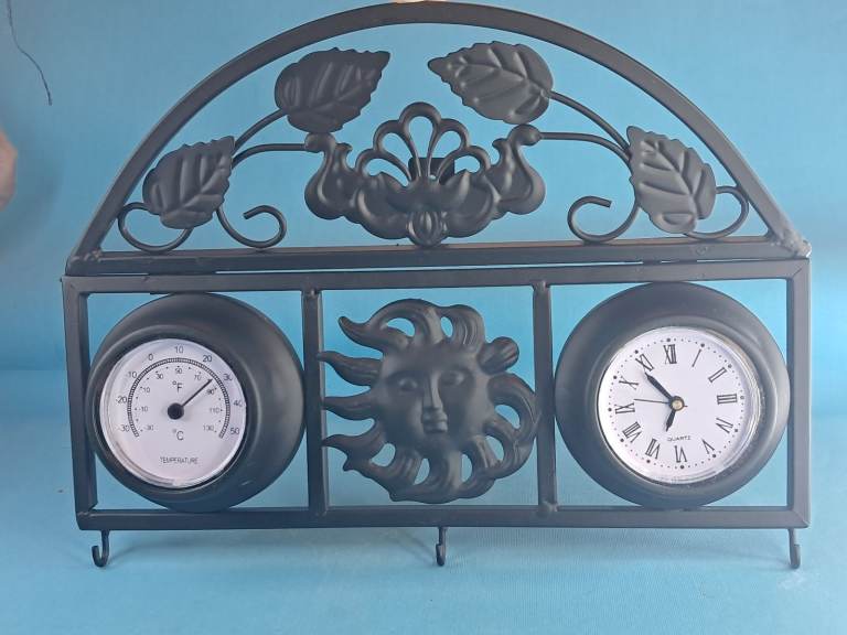 Decorative Wall Planter with Clock and Thermometer. Home decoration or garden.
