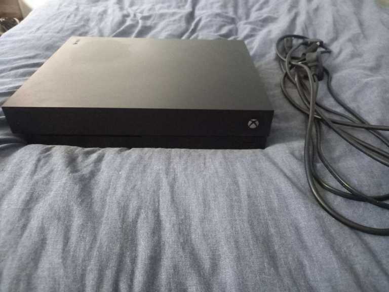 Xbox One x Console with Power Cables – Good Condition