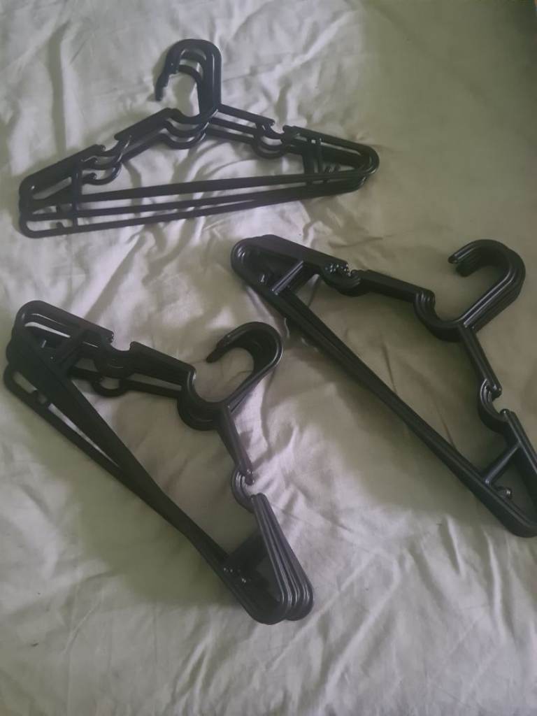 image for 24 black clothes hangers