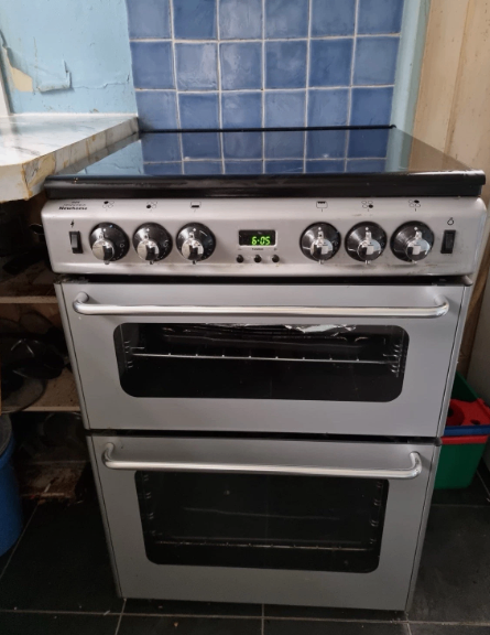 New World 550TSIDOM freestanding double oven gas cooker and extractor hood