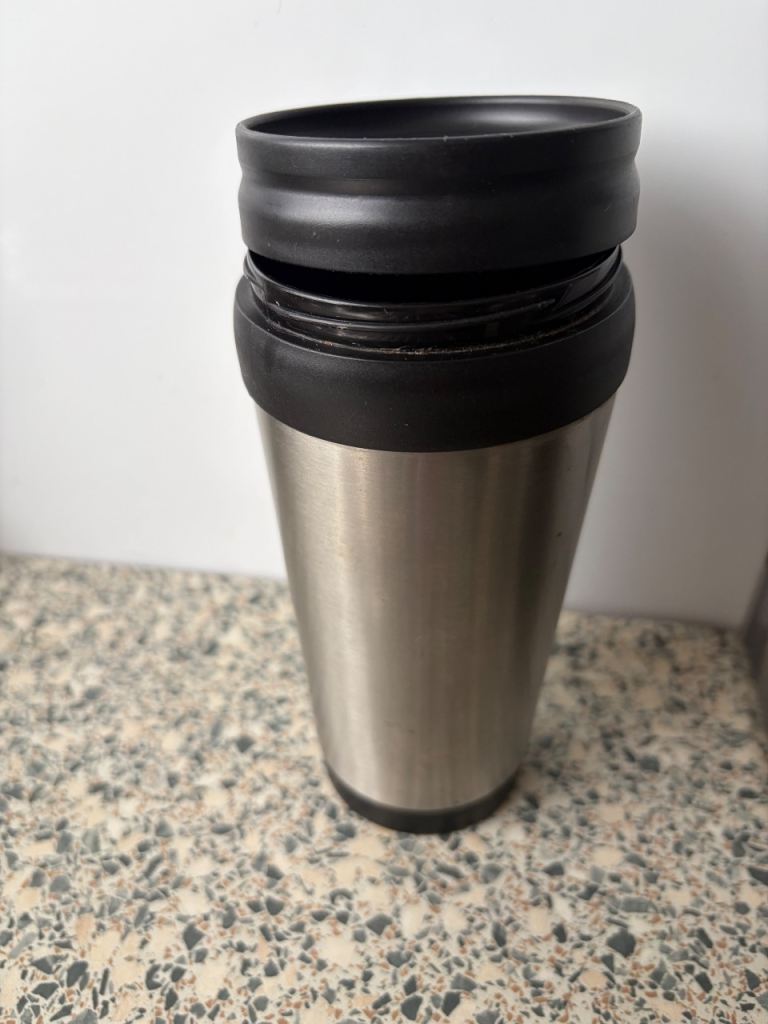 Stainless Steel Travel Mug with Black Lid – Good Condition