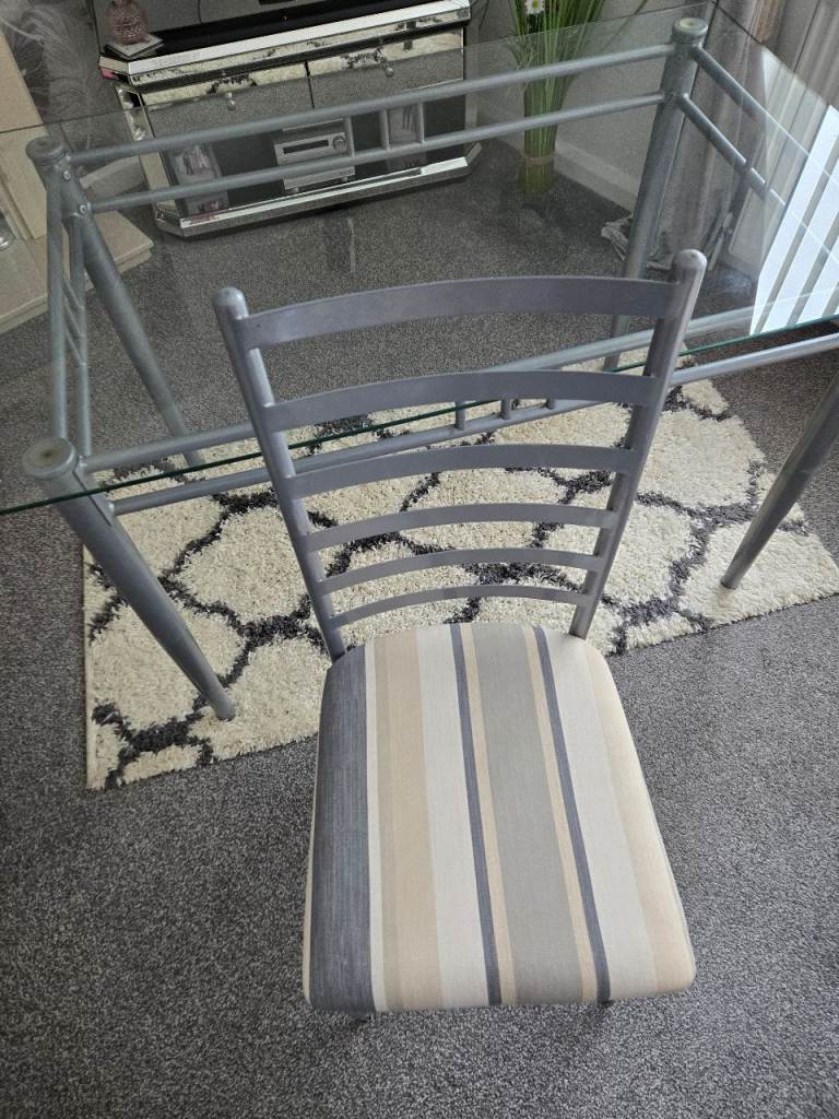 Glass table and four chairs