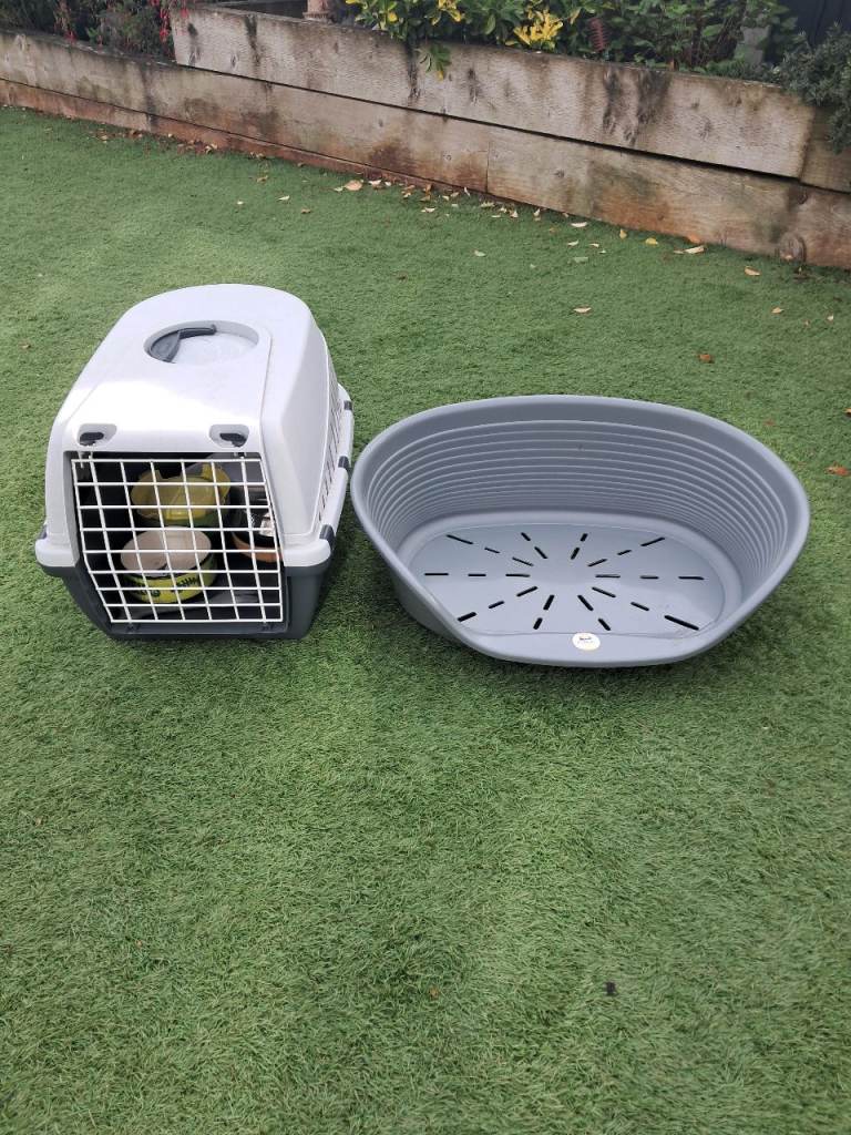 Cat carrier, bed without cushion and odd bowls 