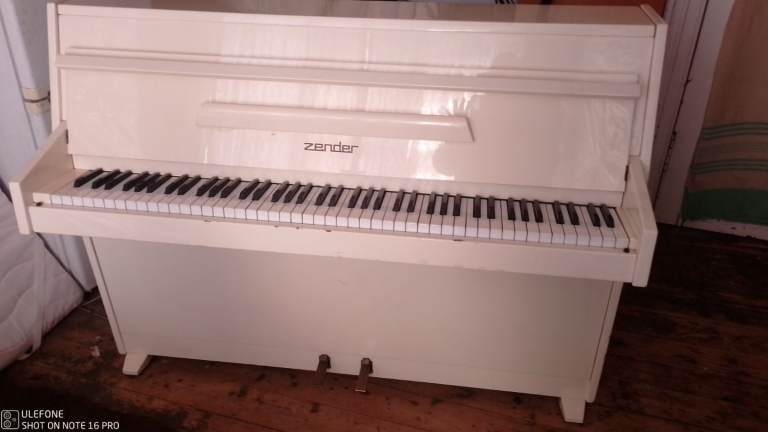 Lovely little piano in ivory 