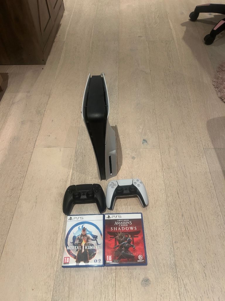 PS5 (2 Controllers + Games) – Like New