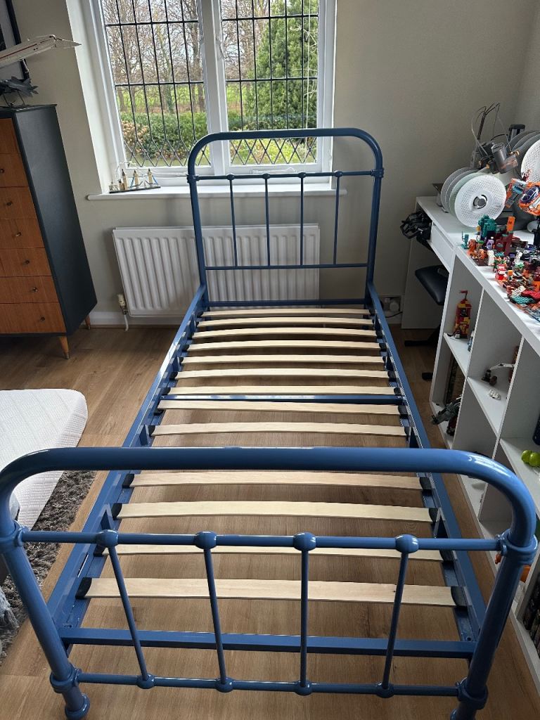 Single blue metal bed 