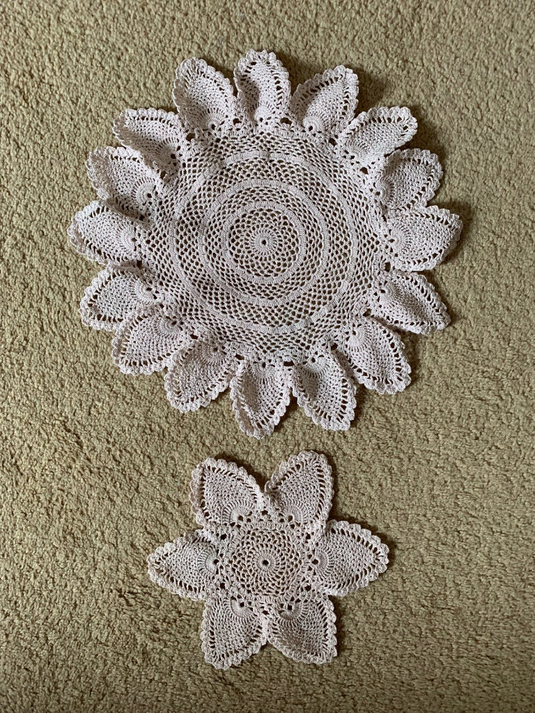 Two crochet doilies.