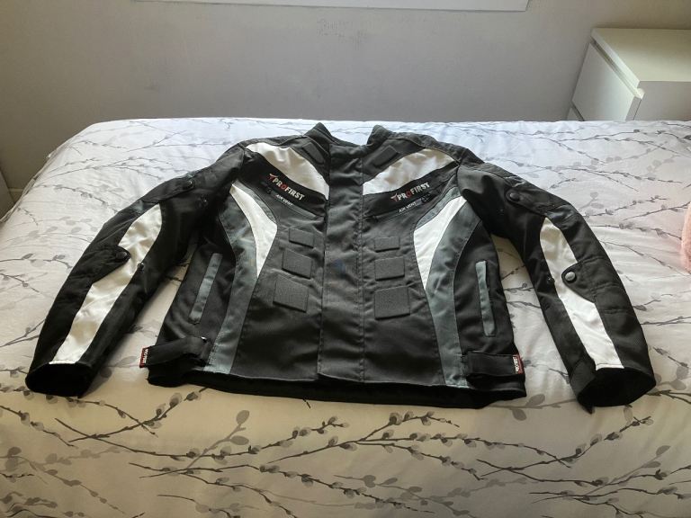 Motorcycle Jacket, trousers, boots and gloves.