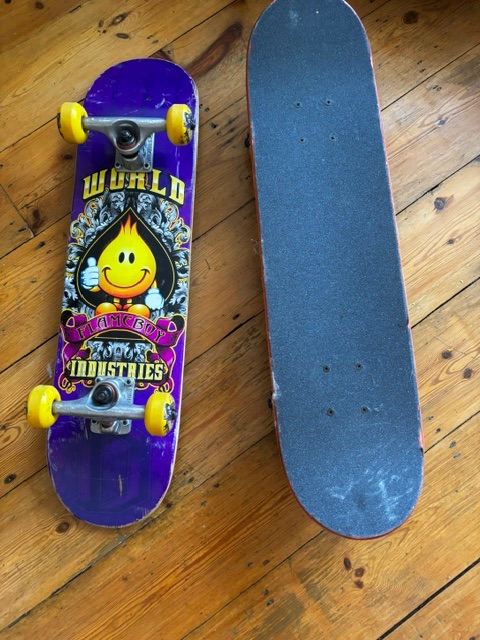 WORLD INDUSTRIES Skateboard - Purple with Yellow Wheels