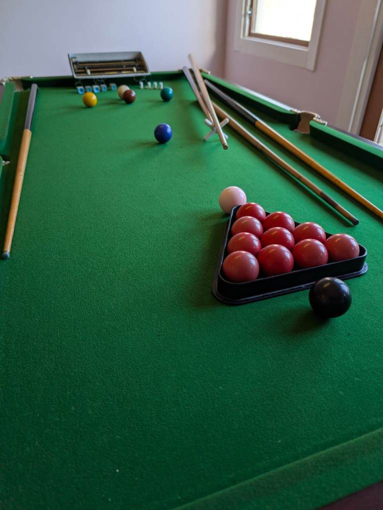 Small snooker table with accessories