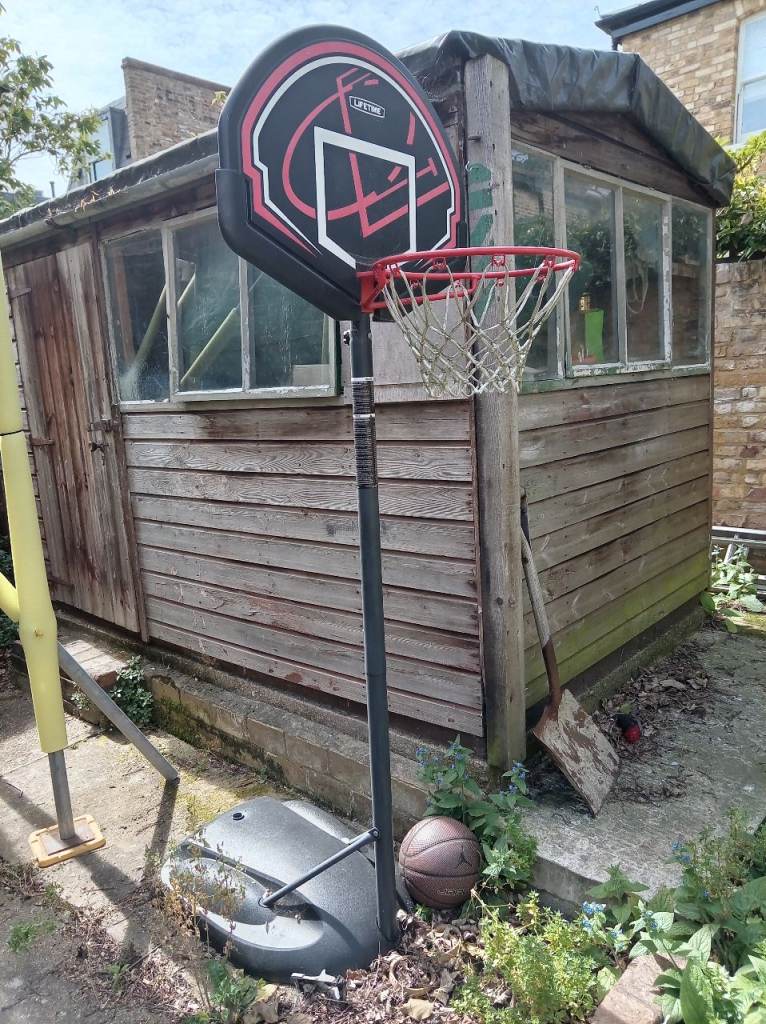 Basketball and outdoor basketball hoop