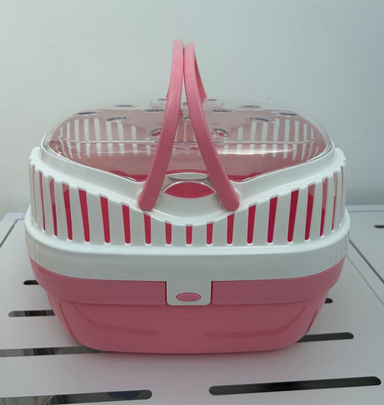 Pink and white pet carrier for small animals