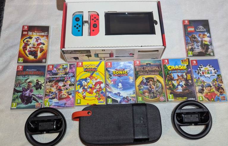Nintendo switch bundle, boxed  with 9 games