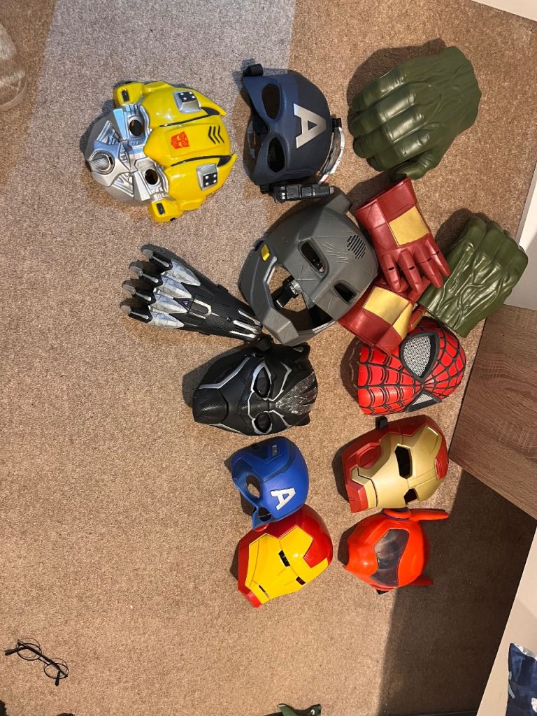 Assortment of superhero masks and accessories