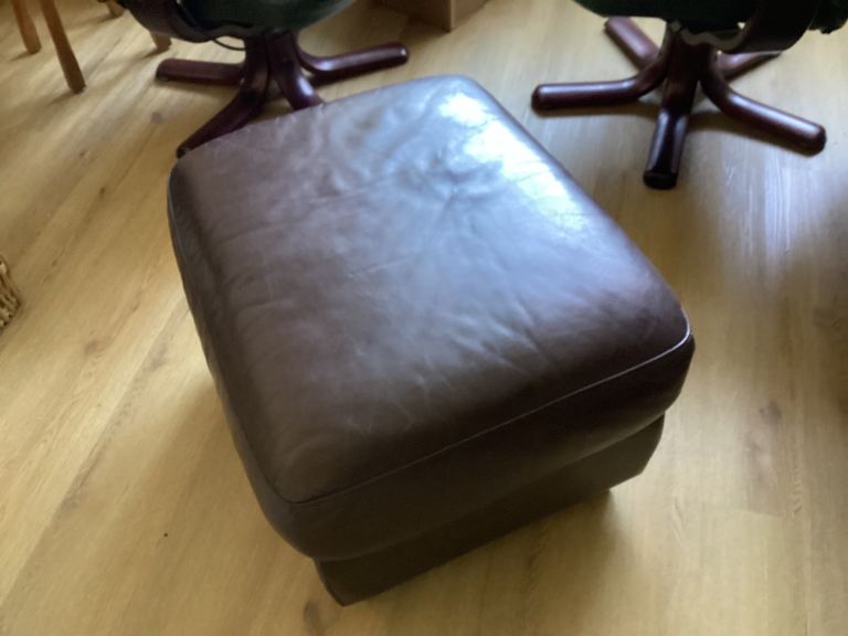 Large leather footstool. 