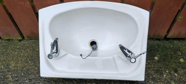 A bathroom sink, used but good 