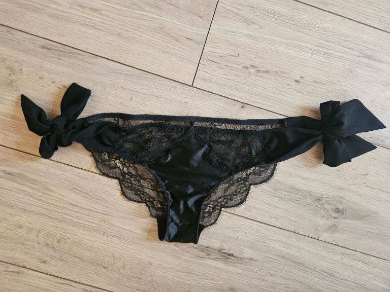 Two pairs of side tie black lace panties