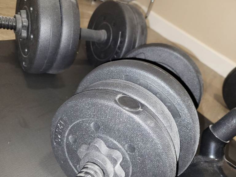 Barbell and dumbell sets with weights and a kettle bell kettlebell