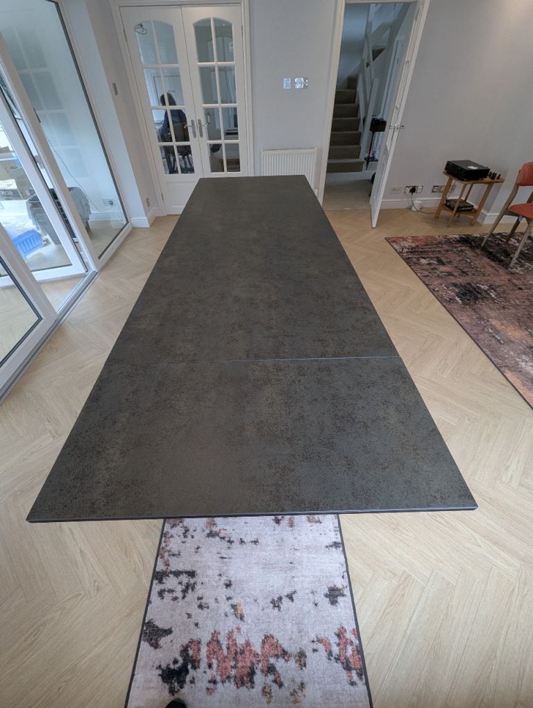 Calesa extending dining table, ceramic top colour Neolith Iron Moss extends to 294 cm