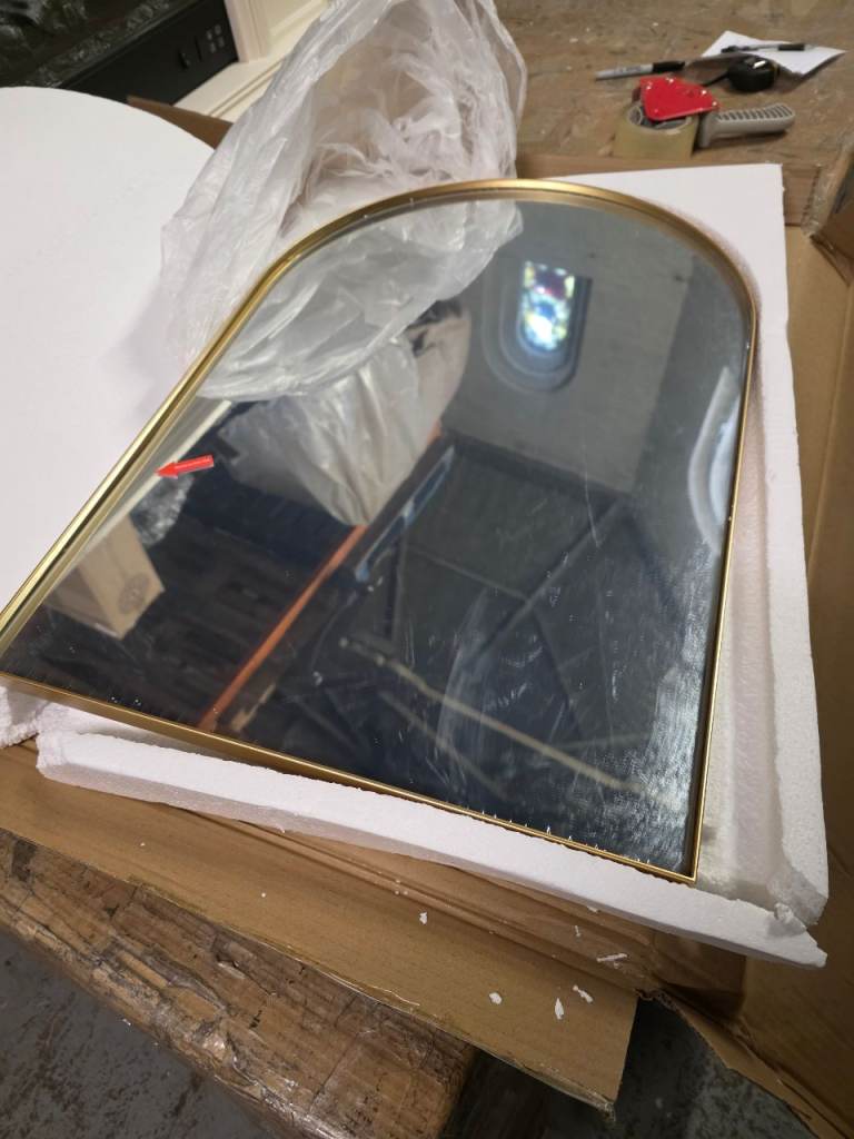 A new still boxed gold rimmed arched wall mounted mirror the measurements are 