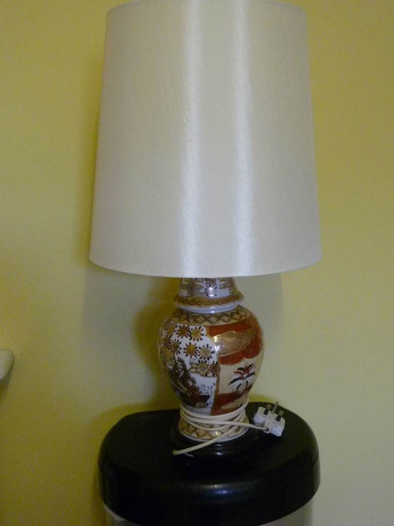 A Patterned Table Lamp with white shade