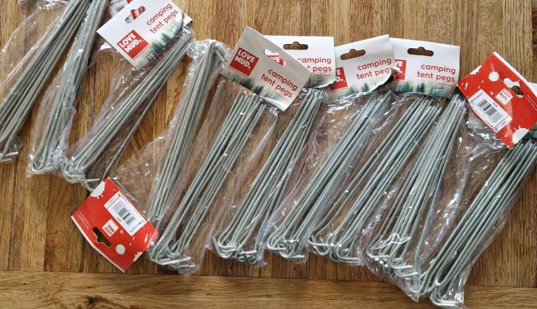 11 packs of new, unused Camping Tent Pegs - Metal, Pack of 10