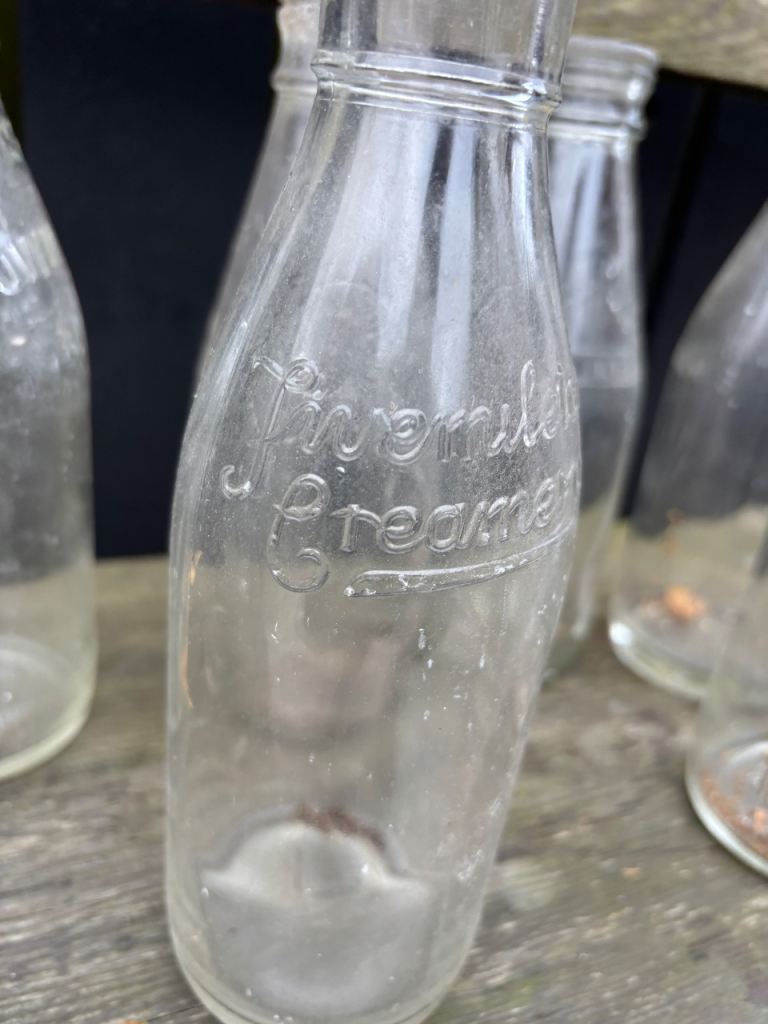 9 old glass milk bottles 