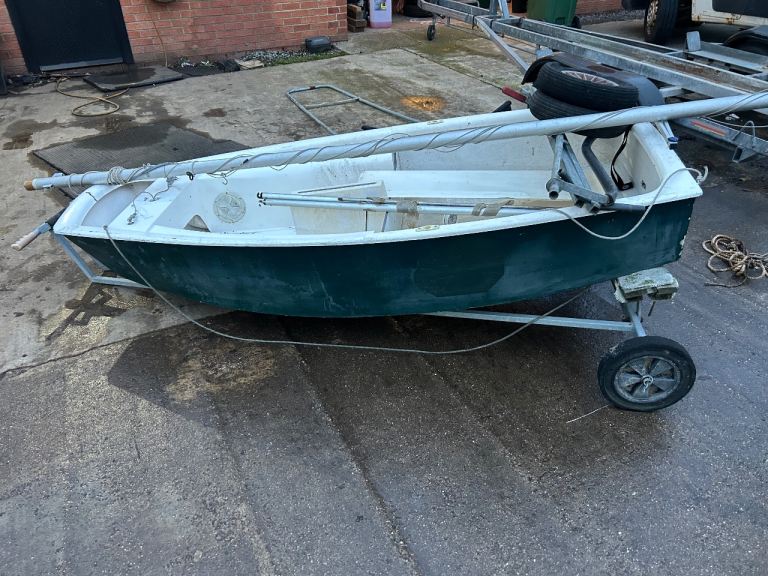 Optimist sailing dinghy and launch trailer