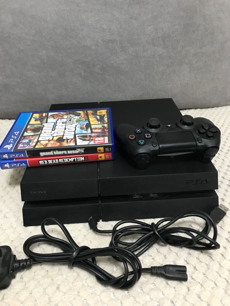 PlayStation 4 PS4 console with two games