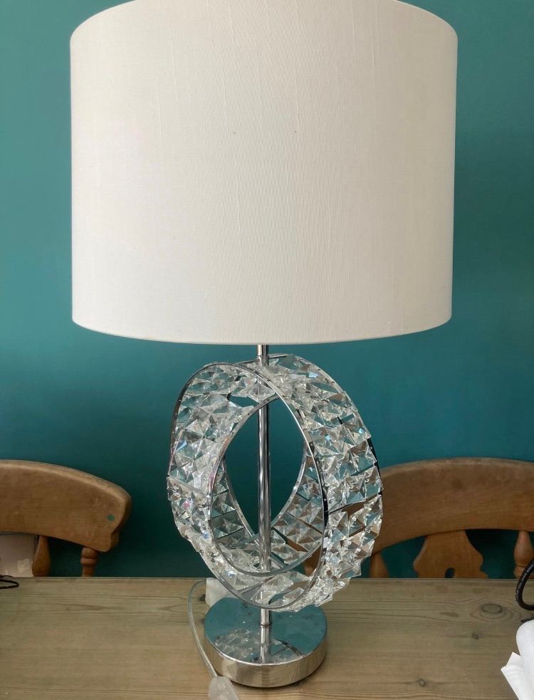 Stunning table light with glass crystals along the stand 