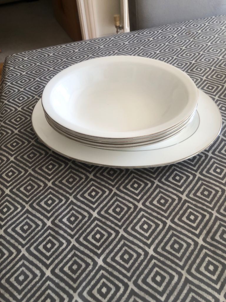 Set of White china Bowls and Plates with Silver Rim