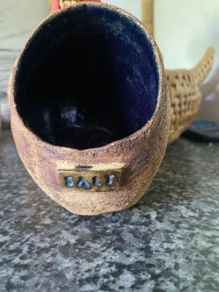 Handmade rustic stoneware bowl with cobalt blue glaze interior and 'SALT' imprint