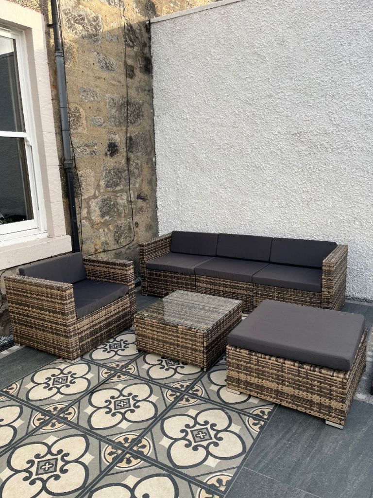Garden, Sofa, Arm Chair, footstool and glass top table. 