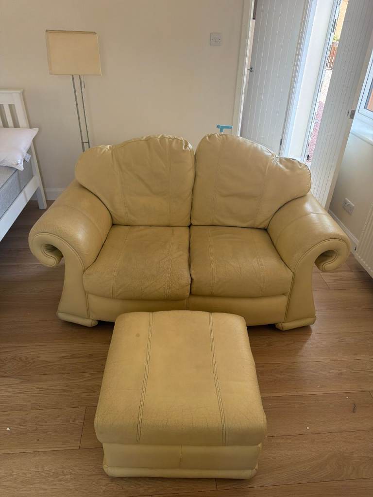 Cream Leather 2-Seater Sofa with Matching Footstool – Okay Condition