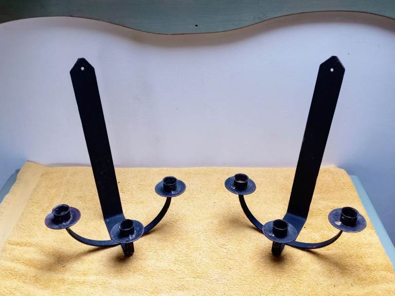 Traditional metal plate candle holders.