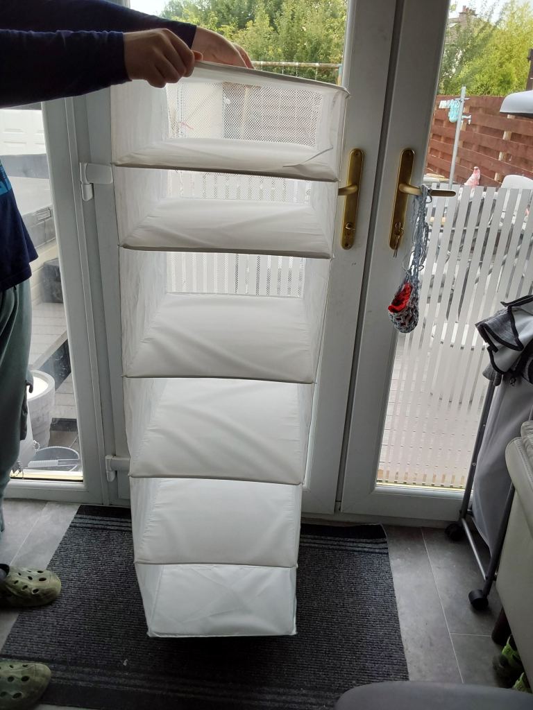 White Hanging Storage Unit with Multiple Compartments – Good Condition