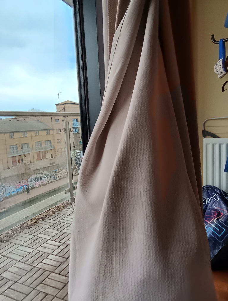 Free pair of curtains by John Lewis in beige oatmeal 