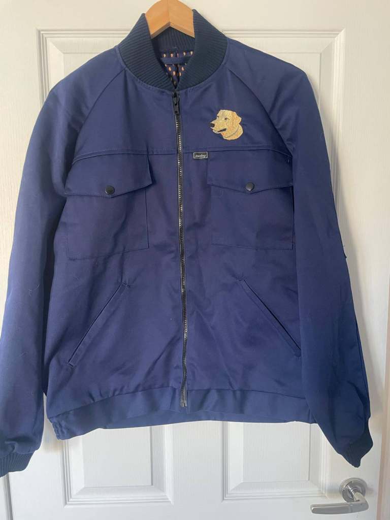 Navy blue bomber style jackets with embroidered dog logo