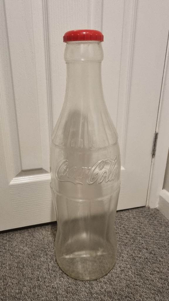 Giant Coca-Cola money bottle 
