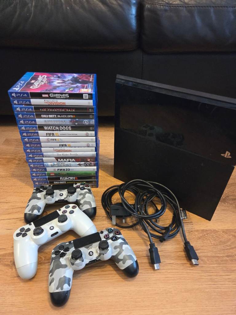 Sony PlayStation 4 (PS4) Console with 2 Controllers & Games